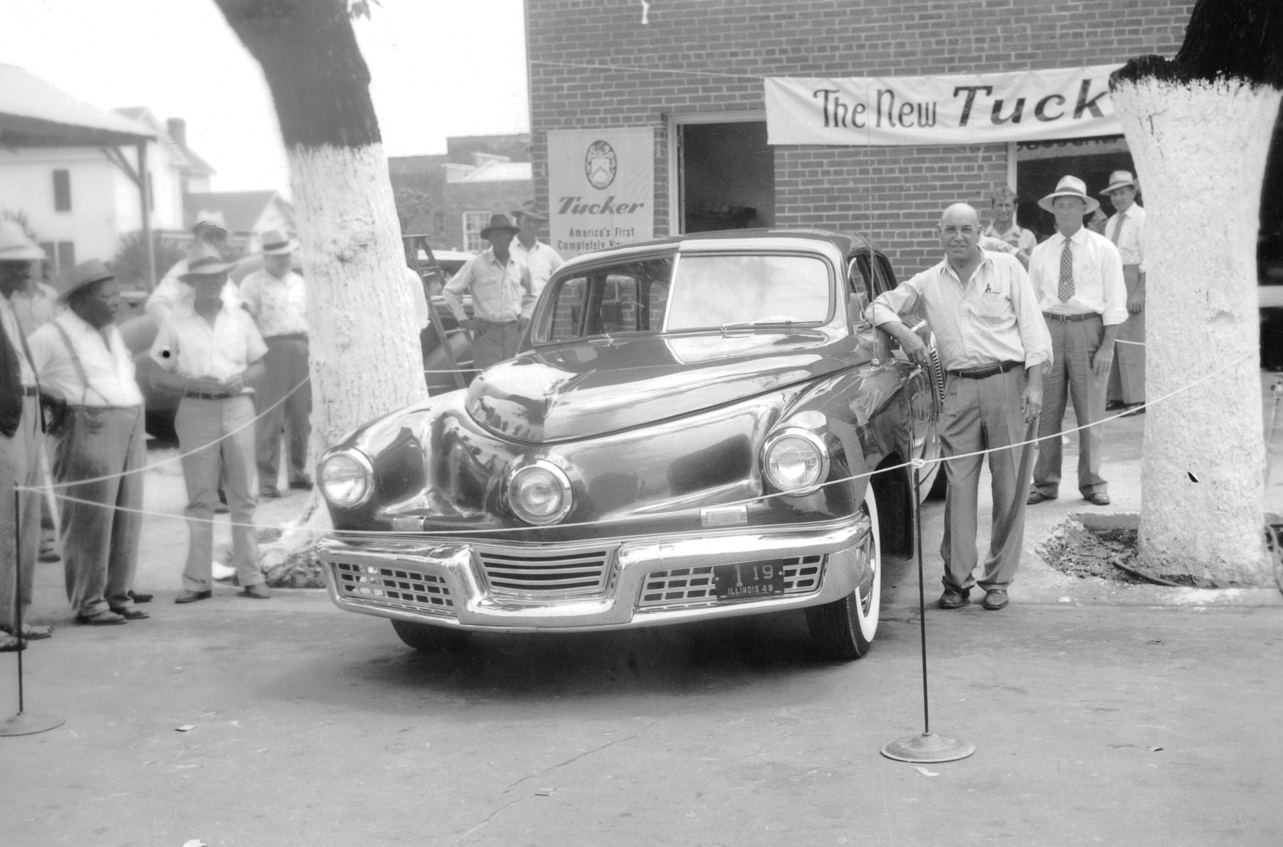 Crowd around a Tucker '48 at a dealer showing, 1948
