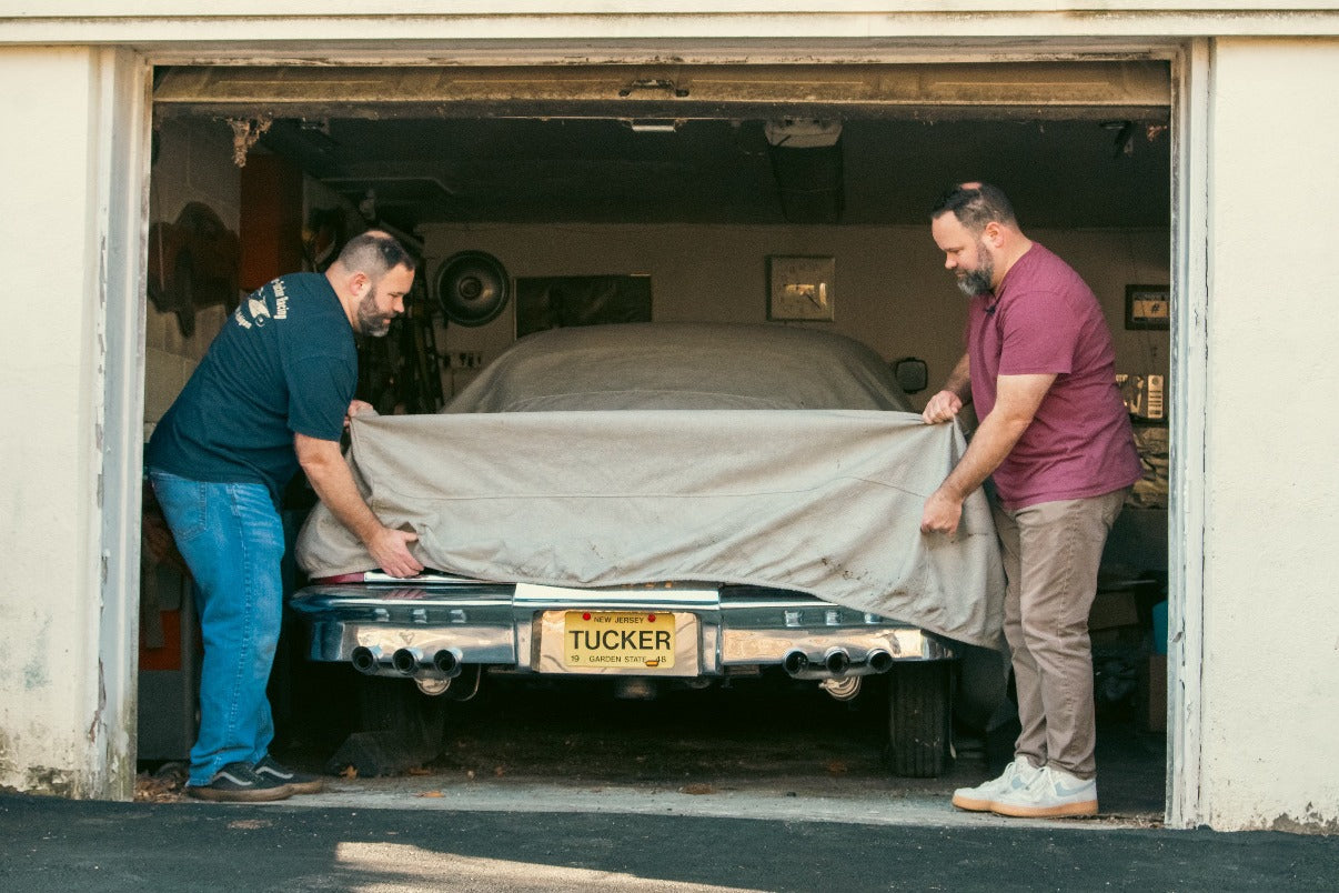 Sean and Mike Tucker pull the cover off Tucker #1051 in a New Jersey garage